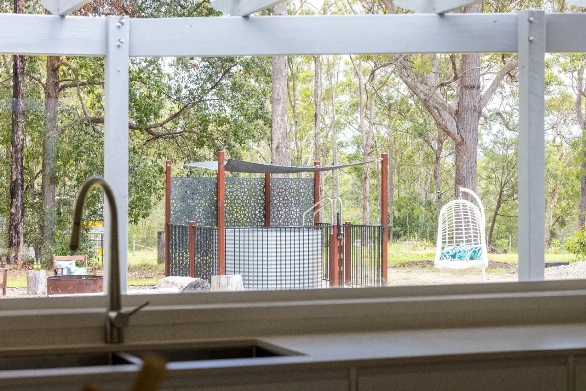 Original view of the installed prototype across the garden from the house